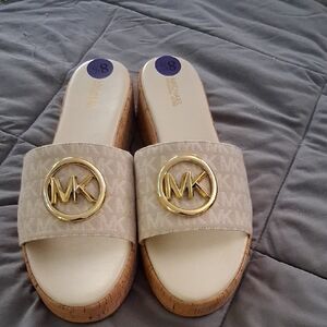 Michael Kors Cream Mules with Gold Medallion